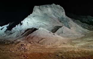 moonlit gravel pile